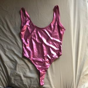 Bright metallic pink body suit